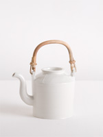 teapot with moulded shoulder portion and cane handle